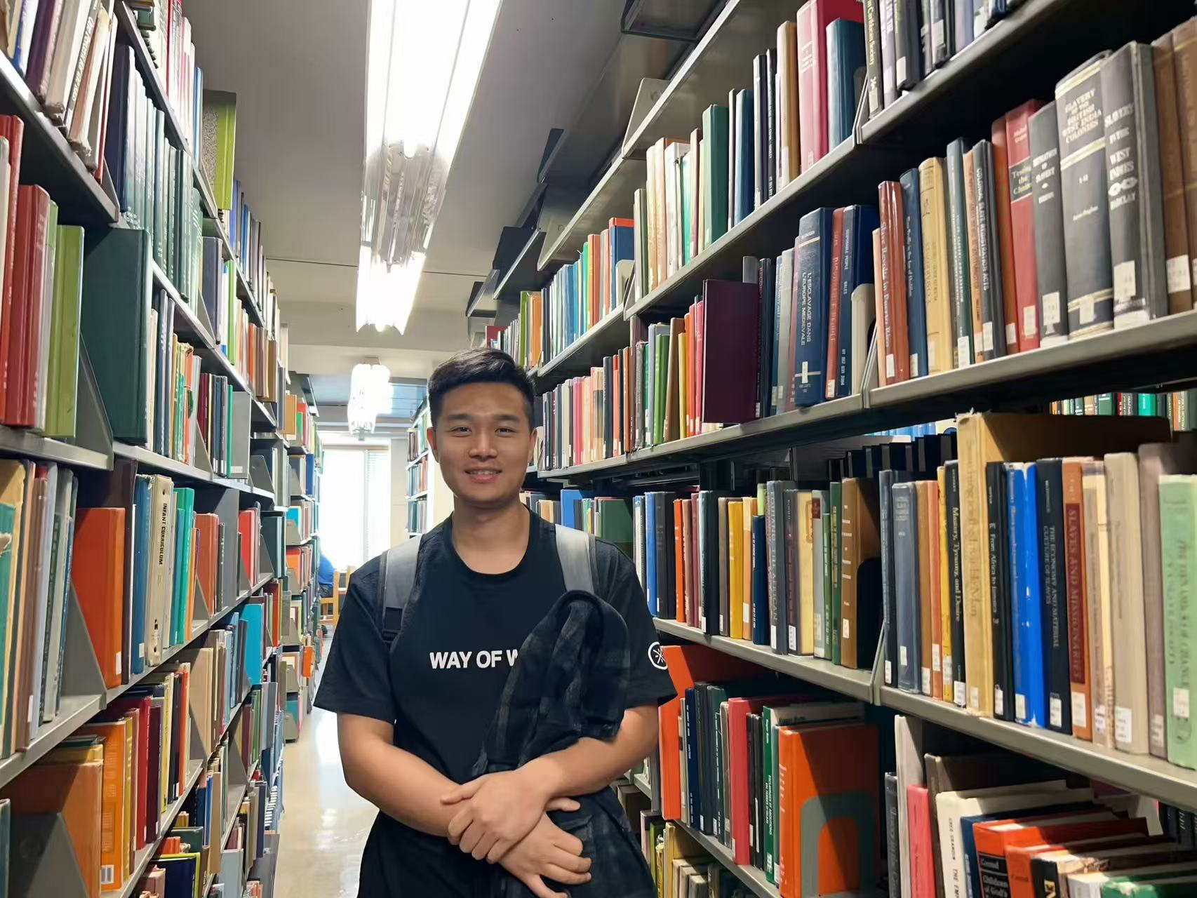 Chi Zhang in a library